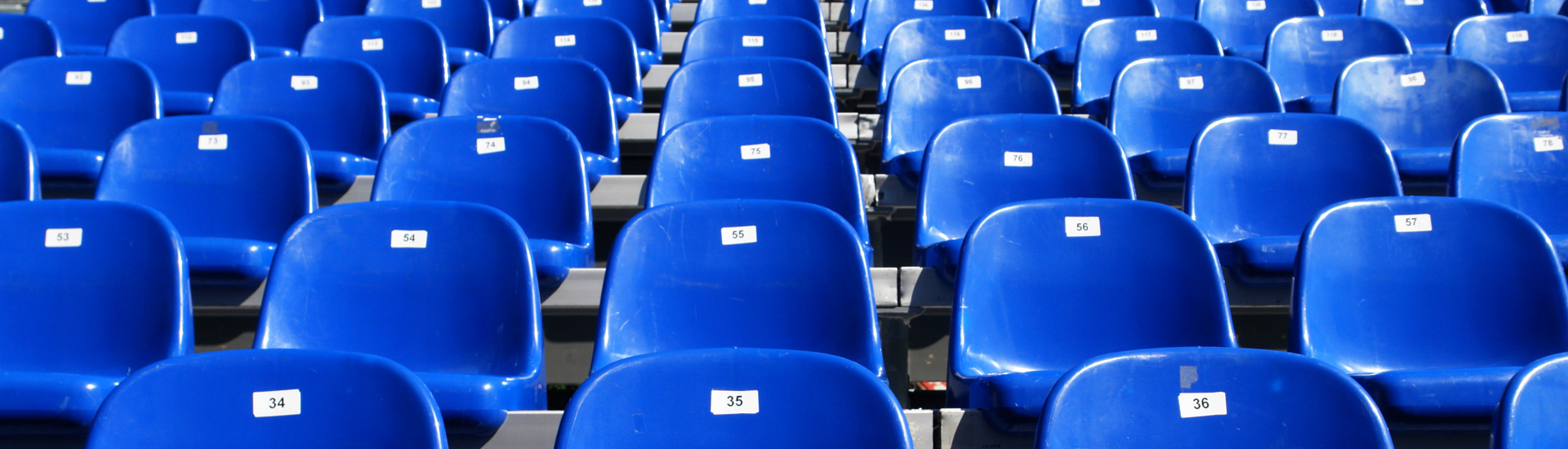 Blue plastic seats in a stadium